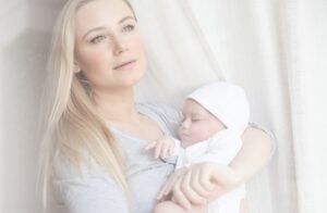 Cute mother with newborn baby