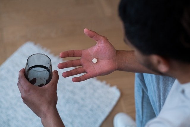 collagen supplement on man's hand